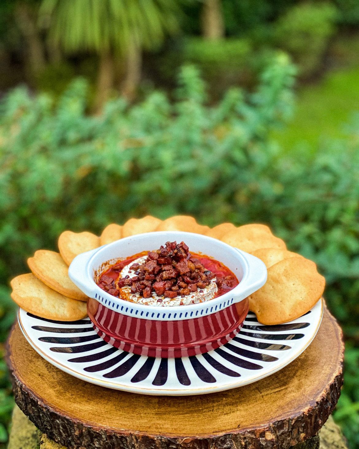 Baked Goats Cheese in Fritada Sauce with Candied Pancetta