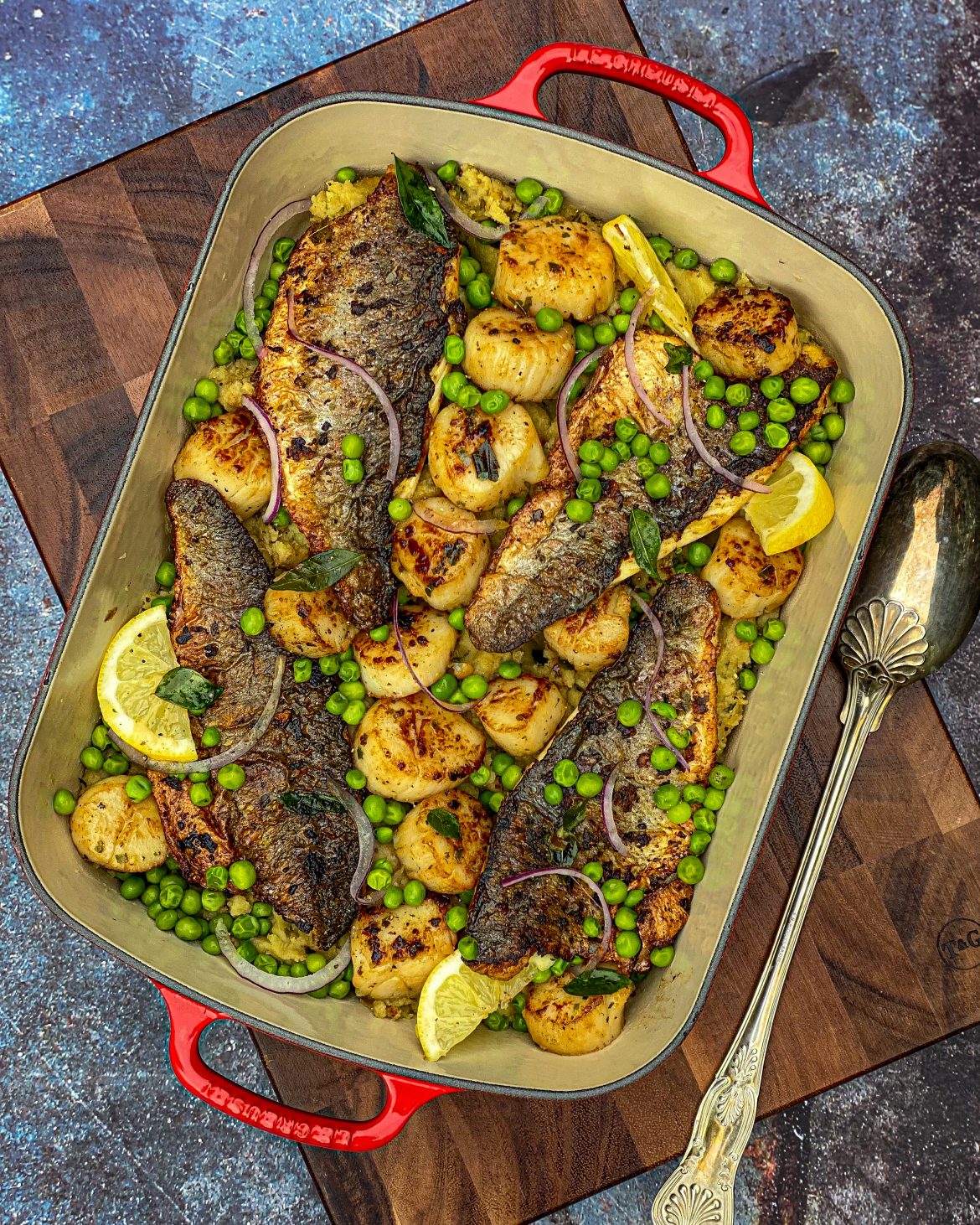 Crispy Sea Bass & Seared Scallops Drizzled With Curry Leaf Butter On A Bed Of Crushed Masala Potatoes